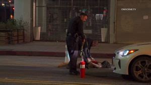 Woman suspected in downtown Los Angeles rampage flees from officers with fire extinguisher in hand